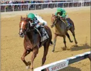  ?? PHOTO CHELSEA DURAND/NYRA ?? Promises Fulfilled with Luis Saez aboard leads Chad Brown trained Engage to the finish line Saturday during the runnig of the Grade 3 Amsterdam.