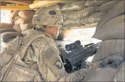  ?? SUSANNAH GEORGE — THE ASSOCIATED PRESS FILE ?? A U.S. Army soldier guards a position at Camp Swift in northern Iraq.