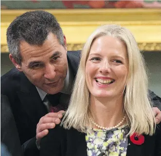  ?? JUSTIN TANG/ THE CANADIAN PRESS ?? Hunter Tootoo, minister of fisheries, oceans and the Canadian Coast Guard speaks with Catherine McKenna, minister of the environmen­t and climate change as they wait for a group photo on Wednesday in Ottawa after being sworn in.