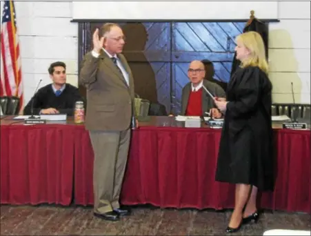  ?? SUBMITTED PHOTO - KUTZTOWN BOROUGH ?? New Kutztown Mayor Jim Schlegel sworn in by Honorable Judge Gail Greth during Kutztown Borough Council’s Reorganiza­tion meeting on Jan. 2.