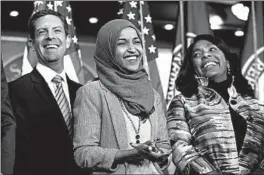  ?? J. SCOTT APPLEWHITE/AP ?? Rep.-elect Mike Levin, D-Calif, Rep.-elect Ilhan Omar, D-Minn., and Rep. Terri Sewell, D-Ala., on Friday discuss House priorities when the new Congress convenes in January.