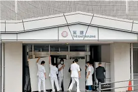  ?? AP ?? An entrance is blocked at Saiseikai Arida Hospital in Yuasa in the western Japanese prefecture of Wakayama, where a doctor was confirmed to have been infected with Covid-19 in February. Hospitals in Japan are increasing­ly turning away sick people in ambulances as the country braces for a surge in coronaviru­s infections.