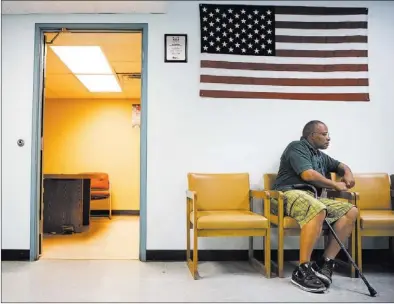  ?? JEFF SCHEID/ LAS VEGAS REVIEW-JOURNAL ?? Army veteran Lawrence Forbes, 53, sits in the lobby of Veteran Services, at 35 W. Owens Ave., on Wednesday. Forbes, who was homeless, was placed in permanent housing through the federal Veterans Affairs Supportive Housing program.