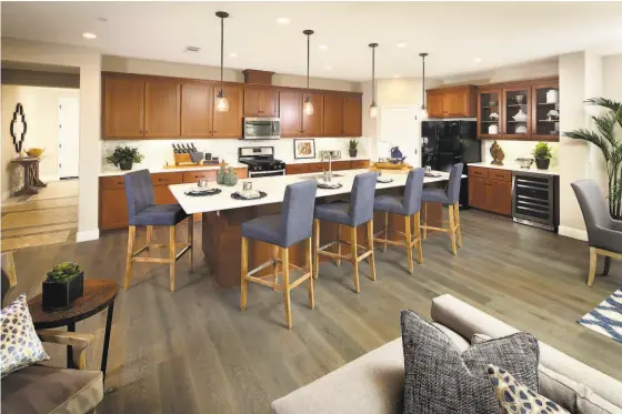  ?? DAVIDON HOMES ?? Gourmet kitchens with granite countertop­s, stylish cabinetry and Whirlpool appliances.
