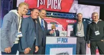  ?? ?? The Magic contingent, from left to right, of Cole DeVos, Joel Glass, Alex Martins, Jamahl Mosley, Jeff Weltman and John Hammond were all smiles after landing the No. 1 pick Tuesday night in Chicago.