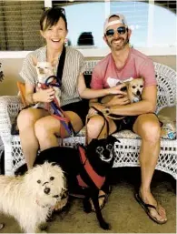  ?? COURTESY OF CHRIS PARKES ?? Chris Parkes (right), a 43-year-old sales director living in La Mesa, has taken up fostering dogs.
