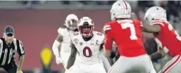  ?? MARK J. TERRILL/AP ?? Utah linebacker Devin Lloyd (0) defends during the Rose Bowl against Ohio State on Jan. 1 in Pasadena, Calif.