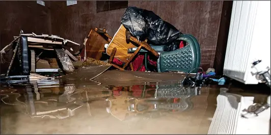  ??  ?? Heart-breaking: Even after being pumped out by the emergency services, this Hawick home was still under about six inches of water