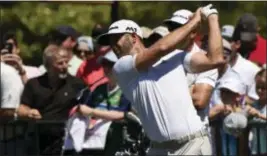  ?? KEN BLEVINS — STARNEWS VIA AP ?? Dustin Johnson warms up on the driving range during practice at the Wells Fargo Championsh­ip at Eagle Point golf course on Tuesday in Wilmington, N.C.