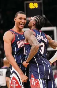  ?? David J. Phillip/Associated Press ?? The Rockets’ Jabari Smith Jr., left, celebrates with Kevin Porter Jr. after his game-winning basket.