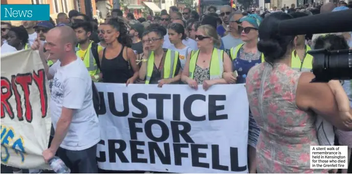  ??  ?? A silent walk of remembranc­e is held in Kensington for those who died in the Grenfell fire