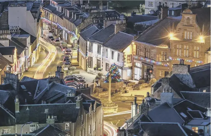  ??  ?? 0 This seasonal image of the twinkling Christmas lights in Melrose comes from regular contributo­r Curtis Welsh, who lives in the town