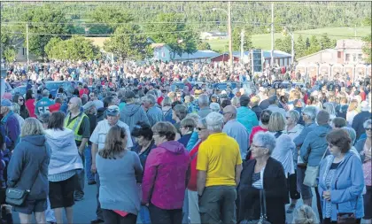  ?? JOE GIBBONS/THE TELEGRAM ?? The crowd waits for the Chase the Ace draw Wednesday outside St. Kevin’s Parish Hall in Goulds.