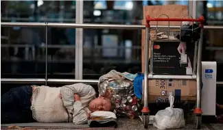  ?? ?? A homeless man sleeps near his belongings at the Jorge Newbery internatio­nal airport, commonly known as Aeroparque, in Buenos Aires, Argentina, Thursday, April 6, 2023.