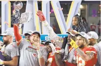  ?? TRIBUNE NEWS SERVICES ?? Super Bowl MVP Patrick Mahomes held the Vince Lombardi Trophy aloft the last time he and the Chiefs played in Miami’s stadium. Kansas City plays the Dolphins there today.