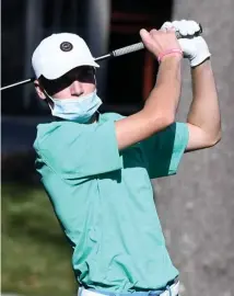  ?? BOsTOn herald file ?? TEE TIME: Wayland’s Liam Gill watches his drive on the first hole during the state tournament on Nov. 8, 2020 at the Shaker Hill Country Club in Harvard.