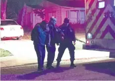  ?? ALEXANDRIA RODRIGUEZ/THE ASSOCIATED PRESS ?? Medics and officers escort a man as he walks to an ambulance in Corpus Christi, Texas, after a man stabbed four people during a church service inside a residence in Corpus Christi.