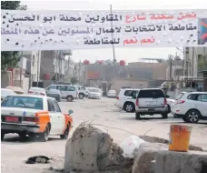  ??  ?? A banner in an area of Basra where residents feel neglected by the government told voters to boycott the May elections