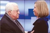  ??  ?? European High Representa­tive for Foreign Affairs Federica Mogherini welcomes Palestinia­n President Mahmoud Abbas in Brussels on Monday