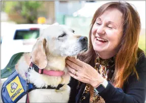  ?? MARK BRETT/Special to The Herald ?? Penticton RCMP Victim Services manager Dede Dacyk with her PADS service dog Calypso. Lauren Calancie is riding her bike to Calgary as a fundraiser for service dogs.