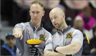 ?? ADRIAN WYLD, THE CANADIAN PRESS ?? Skip Brad Jacobs of Sault Ste. Marie, left, discusses a shot with Ryan Fry at curling’s Olympic Trials on Thursday.