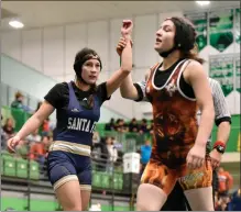  ?? ?? Nicole Tafoya walks off the mat as Myranda Pena is declared the winner.