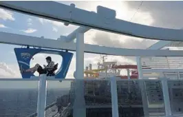  ?? RICHARD TRIBOU/STAFF ?? Carnival’s Vista-class ships feature a SkyRide attraction that lets riders pedal vehicles suspended from a track that runs above the top deck of about half the ship.