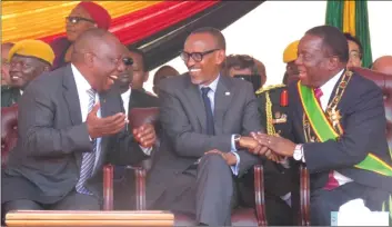  ??  ?? BROTHERLY INTIMACY . . . President Mnangagwa having a good laugh with African Union chairperso­n, Rwandan President Paul Kagame and his South African counterpar­t President Cyril Ramaphosa at his swearing-in ceremony at the National Sports Stadium on August 26