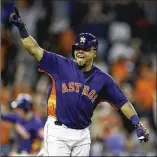  ?? BOB LEVEY / GETTY IMAGES ?? Houston catcher Juan Centeno celebrates after his second hit Sunday, a walkoff single that beat the Toronto Blue Jays.