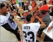  ?? NEWS-HERALD FILE ?? A young fan gets an autograph from Joe Haden at the Browns training camp on July 29, 2016, in Berea.