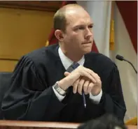  ?? Dennis Byron/Hip Hop Enquirer via AP ?? Judge Scott McAfee addresses the lawyers during a hearing on charges against former President Donald Trump on Thursday in Atlanta. Lawyers for Mr. Trump argued in a court filing that the charges against him in the Georgia election interferen­ce case seek to criminaliz­e political speech and advocacy conduct that is protected by the First Amendment.