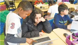 ?? AMY DAVIS/BALTIMORE SUN ?? Students at Bedford Elementary School in Baltimore County work together. Three big suburban school districts — Anne Arundel, Howard and Baltimore counties — have rebelled against tight budgets and are asking for double-digit percentage increases.