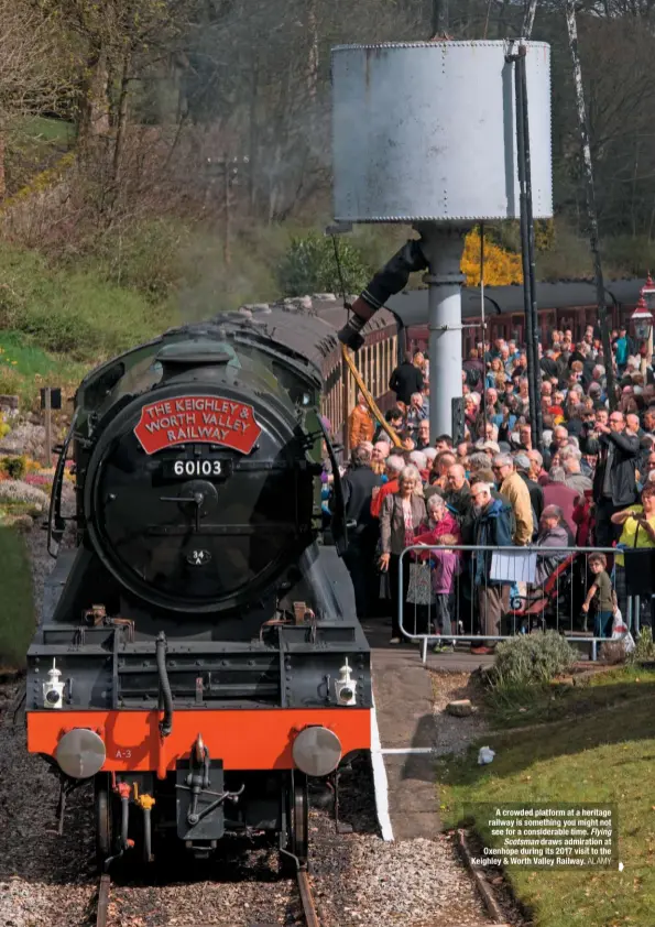  ?? ALAMY ?? A crowded platform at a heritage railway is something you might not see for a considerab­le time. Flying Scotsman draws admiration at Oxenhope during its 2017 visit to the Keighley & Worth Valley Railway.