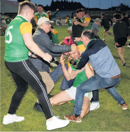  ??  ?? Happier times: Celebratio­ns after Dungannon won the Tyrone Senior Club Championsh­ip last year