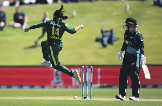  ?? GETTY IMAGES ?? Fatima Sana celebrates after dismissing White Ferns captain Sophie Devine in Dunedin.