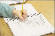  ?? H John Voorhees III / Hearst Connecticu­t Media ?? A high school student prepares for a test.