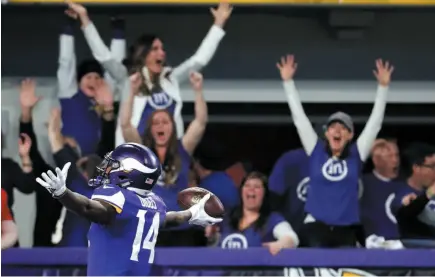  ?? AP PHOTO ?? Minnesota Vikings wide receiver Stefon Diggs celebrates in the end zone after scoring the game-winning touchdown against the New Orleans Saints late in the second half on Sunday in Minneapoli­s. The Vikings defeated the Saints 29-24 in a thriller.