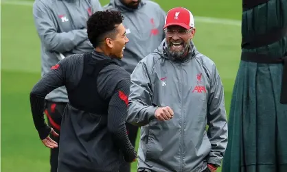  ??  ?? Jürgen Klopp shares a joke with Roberto Firmino during a training session at Melwood. Photograph: Andrew Powell/Liverpool FC/Getty Images