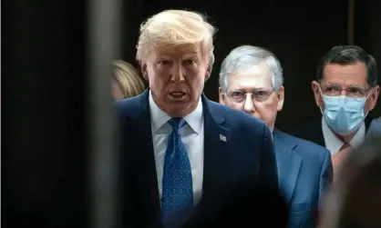  ?? Photograph: Kevin Dietsch/EPA ?? Donald Trump walks with Mitch McConnell on Capitol Hill in May.