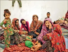  ?? REUTERS ?? Villagers sit inside a relief camp after they were forced to evacuate their village because of Pakistani shelling near the border with Pakistan in Ranbir Singh Pora, southwest of Jammu, on 30 September 2016.