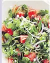  ?? RYAN SZULC/PENGUIN ?? Watermelon combines with flavourful greens and feta in this peppy salad.
