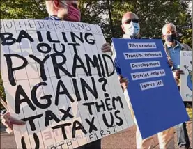  ?? Lori Van Buren / Times Union archive ?? The plan to build a Costco warehouse near Crossgates Mall triggered protests like this one in August 2020 in Guilderlan­d. Two Albany County Planning Board members who voted against the plan are off the board.