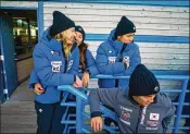  ?? CLIVE MASON /GETTY IMAGES ?? German-born luger Aileen Frisch, who became a naturalize­d citizen of South Korea in order to participat­e in the Pyeongchan­g Winter Olympic Games, schmoozes with her new teammates.