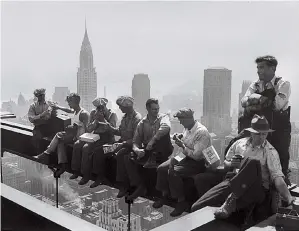  ??  ?? One of the
AP’s legendary photograph­ers captured constructi­on workers lunching on a steel beam atop the 66-story
RCA Building in New York in September 1932.