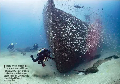  ?? Ann Sommers ?? ■ Scuba divers explore the Dixie Arrow wreck off Cape Hatteras, N.C. There are hundreds of wrecks in the area, dating from the Civil War era to post-World War II.