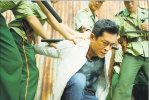  ?? Contribute­d photo / WellGo USA ?? Louis Koo, center, plays a cop in a tough situation in “Chasing the Dragon II: The Wild Wild Bunch.”