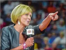  ?? TIM MARTIN/THE DAY ?? UConn associate head coach Chris Dailey receives the Margo Dydek Award during halftime of Tuesday’s WNBA game between the Sun and Storm at Mohegan Sun Arena. The Sun honored Dailey with the award as its 2017 Woman of Inspiratio­n.