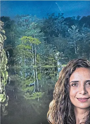  ?? Picture Philippe Echaroux ?? Below: Explorer Ella Al-shamahi, and, main, a member of the Paiter Surui tribe is projected onto trees to highlight deforestat­ion
Jungle Kingdom: Lost Kingdoms Of The Amazon begins this Saturday on Channel 4