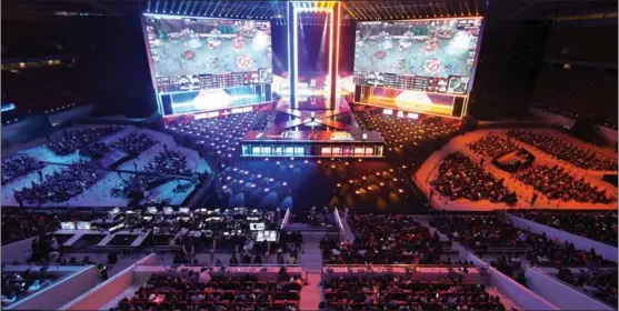  ?? PHOTOS BY GAO ERQIANG / CHINA DAILY ?? Over 6,000 fans, who won their tickets in an online lottery, watch the League of Legends World Championsh­ip at Shanghai Pudong Football Stadium.