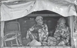  ??  ?? BSF troops sit inside a truck as they arrive in Srinagar on Tuesday to join thousands of federal forces and local policemen already deployed in the Kashmiri capital to contain a 46-day-old unrest.